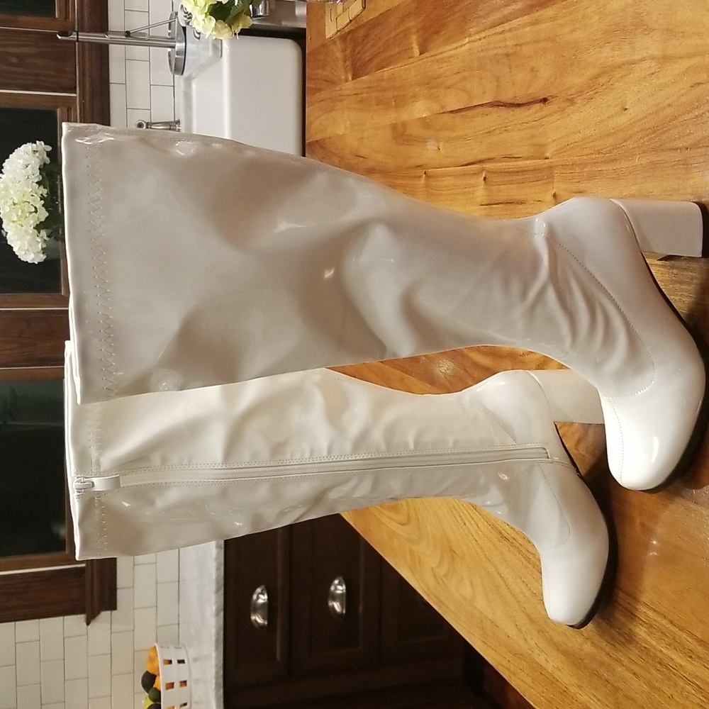 Beautiful white patent knee high boots. Size 6.5